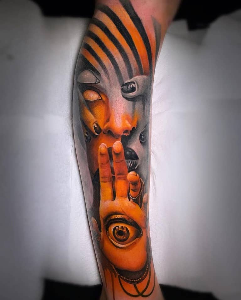 Surrealistic face tattoo with a hand and eyeball in black and gray and color on the leg