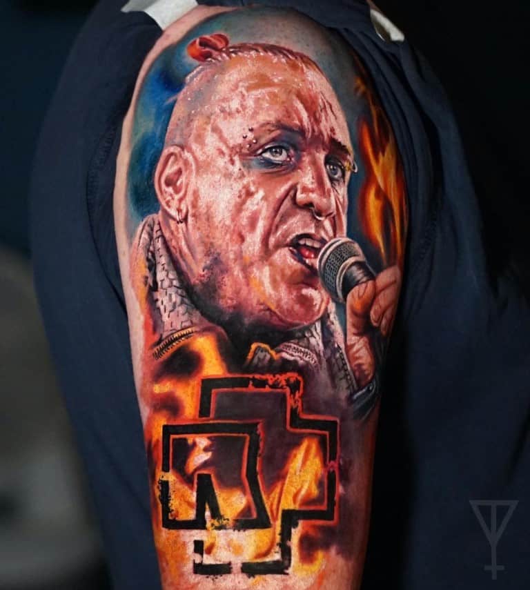 Realistic color tattoo of Till Lindemann, the vocalist of Rammstein, in color with the logo of Rammstain