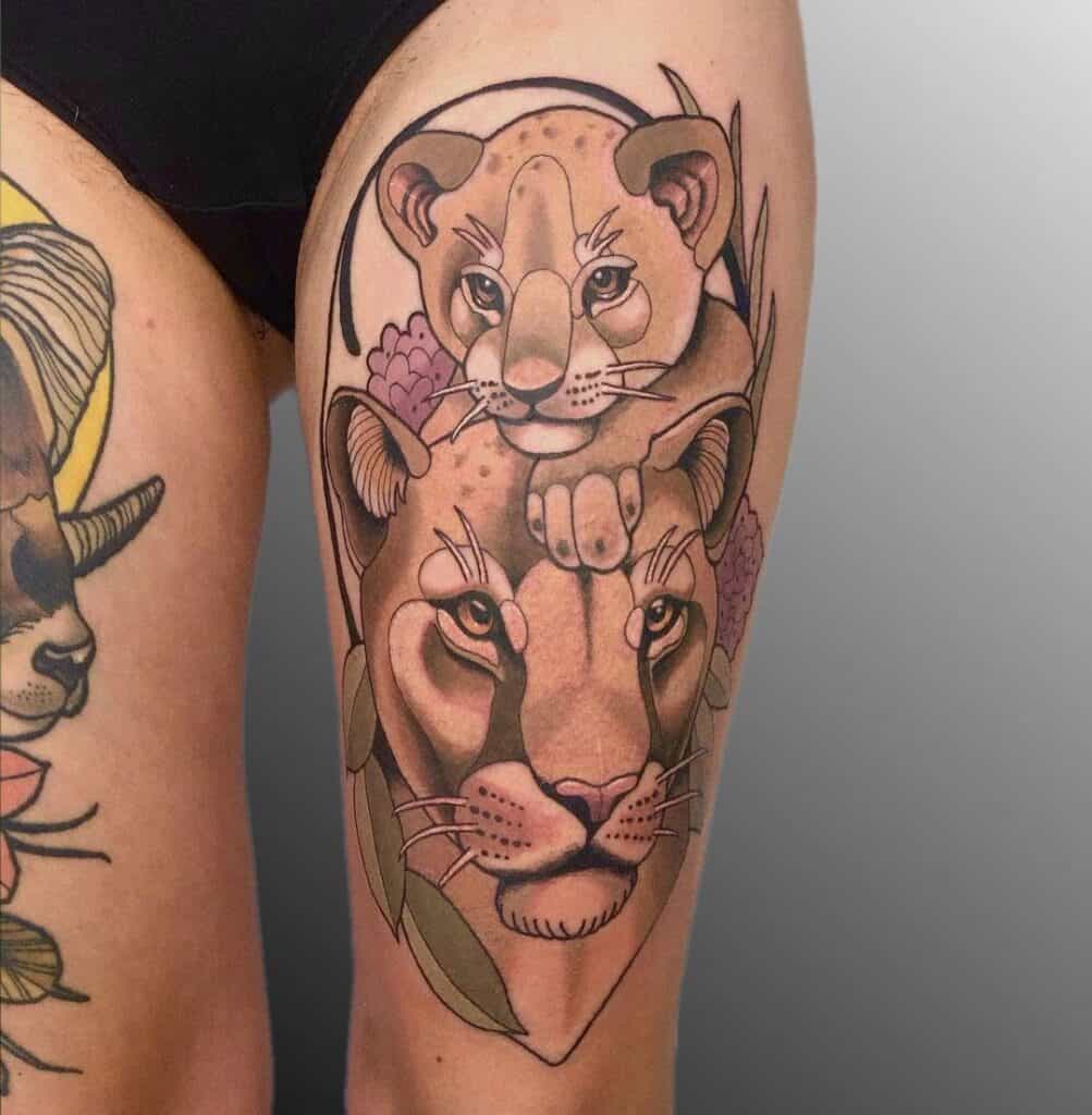 Female lion and cub tattoo
