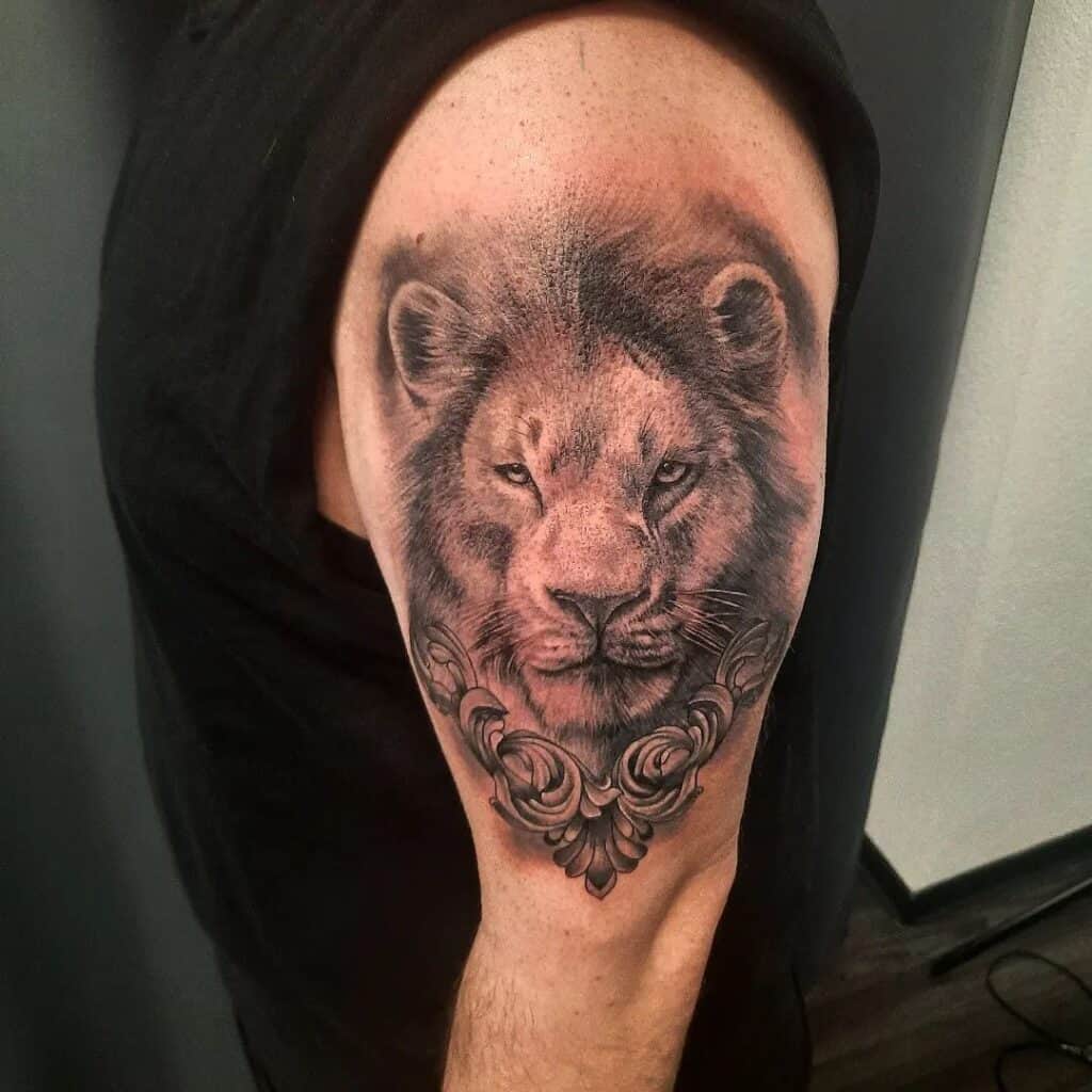 Lion face front tattoo