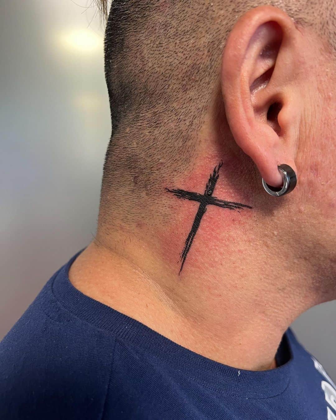 cross tattoo in neck