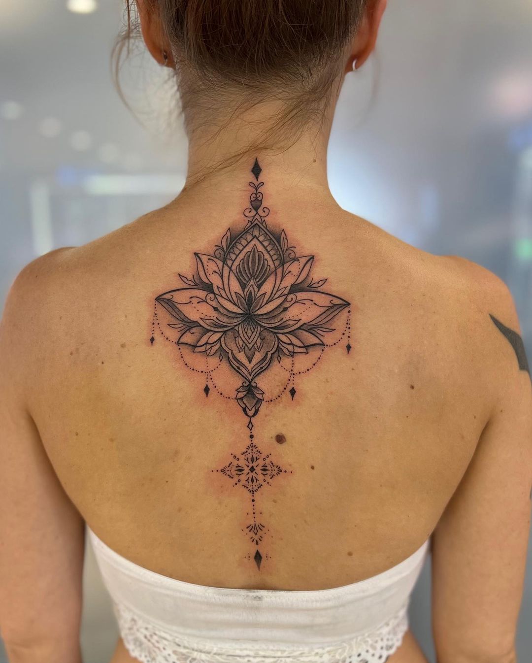 lotus spine tattoo
