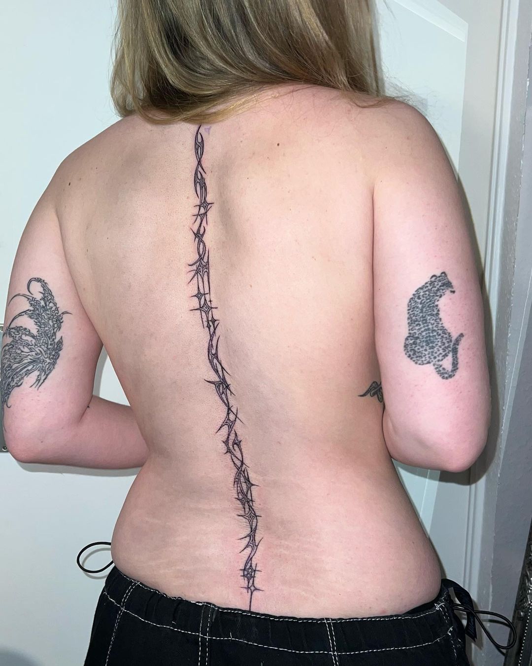 tribal spine tattoo