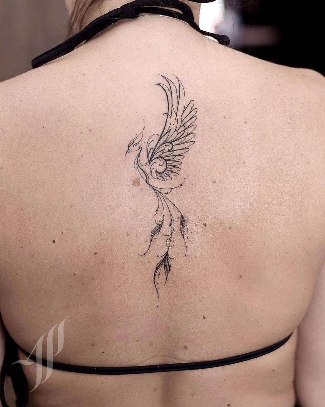 phoenix spine tattoo