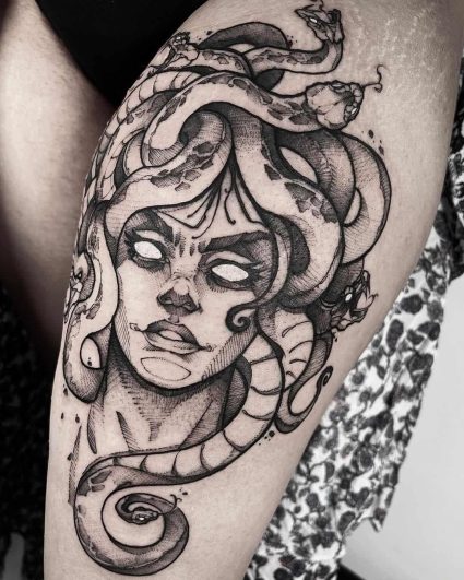 picture of a medusa tattoo on an upper leg